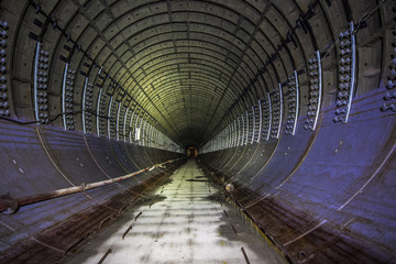 Fototapeta premium Abandoned round subway tunnel under construction. 