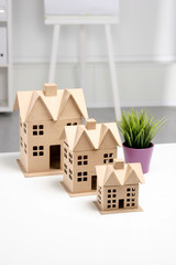 Miniature houses on the desk in office