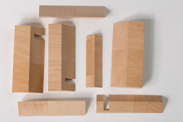 The Abstract elements Wooden blocks, decorative cut in tree, close-up on white background