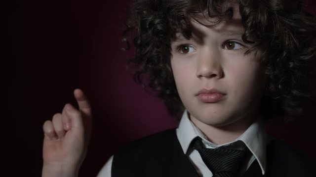 4k Shot of a Cute Businessman Child Clicking on Invisible Button (close-up)
