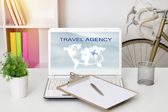 computer laptop with travel and adventure website