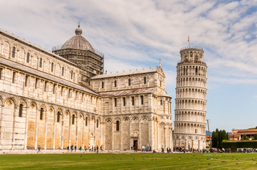 Pisa cathedral with baptistery and leaning tower on the field of Miracles in Pisa town of Italy