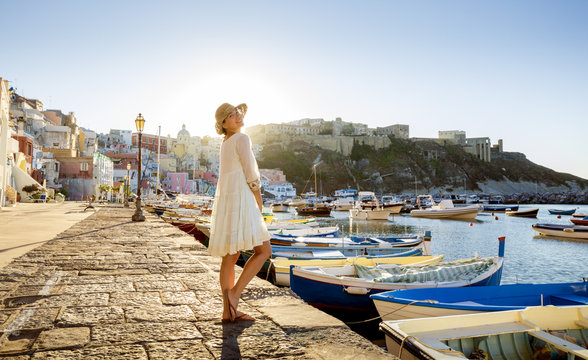 Italian summer fashion - happy girl in a white lacy dress