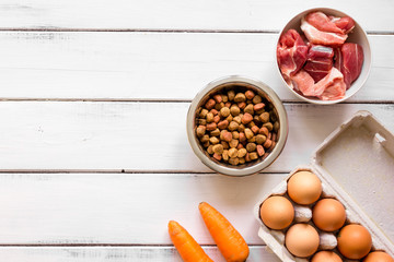 ingredients for pet food holistic top view on wooden background