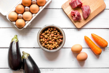 ingredients for pet food holistic top view on wooden background