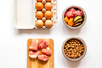 ingredients for pet food holistic top view on white background