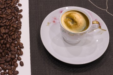 Cup of coffee and coffee beans