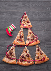 Christmas tree shaped pizza with cherry tomatoes and olives - 131524959