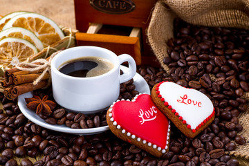 Cup of black tea and heart shaped cookies, for valentine's day