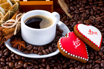 Cup of black tea and heart shaped cookies, for valentine's day