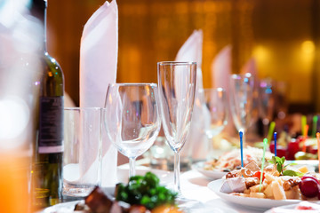 Restaurant table with glasses and napkins