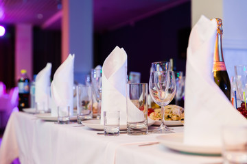 Restaurant table with glasses and napkins