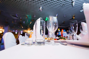 Restaurant table with glasses and napkins