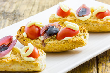 Tasty appetizer of canapes and vegetables