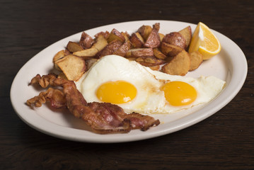 Breakfast - two eggs with bacon and potatoes