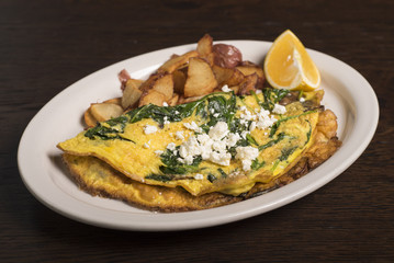 Scrambled eggs with fried potatoes and cottage cheese