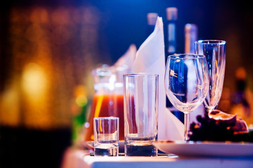 Restaurant table with glasses and napkins