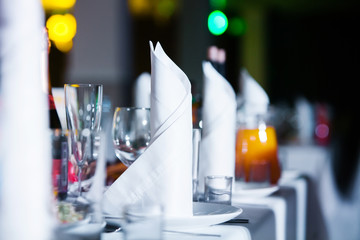 Restaurant table with glasses and napkins