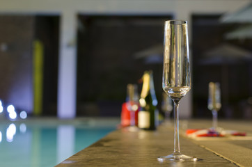Glasses of champagne in the pool