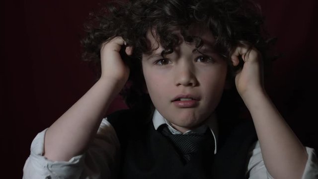 4k Shot of a Cute Businessman Child Shouting and Holding his Hairs