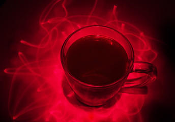 glass coffee mug in the laser beams