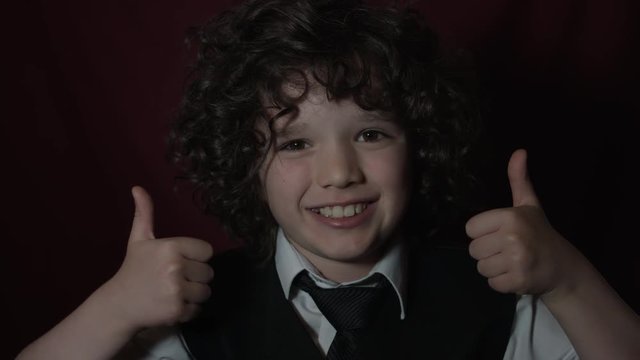 4k Shot of a Cute Businessman Child Showing Thumbs Up Smiling