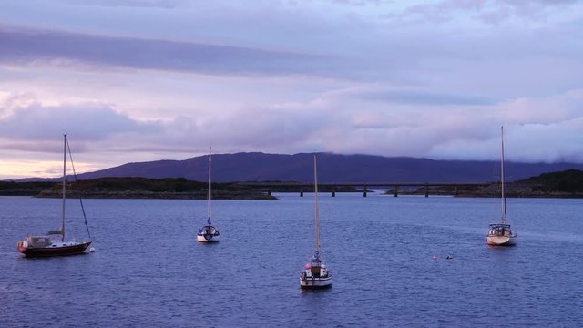 Small boats at Kyle Akin during sunset time in late summer, Kyle of Lochalsh, Isle of Skye, Highland Region, Scotland, United Kingdom
