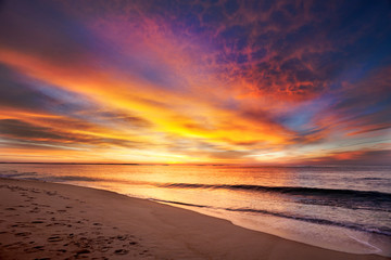 Fototapeta na wymiar Maine beach in vivid colors of pre-dawn light