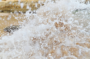 Beach wave splash in Lagoa, Algarve, Portugal