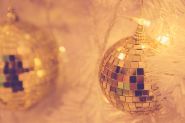 christmas ornaments gold ball and light bulb on christmas tree