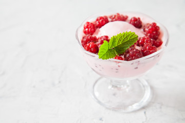 ice cream with raspberry in an ice-cream bowl, selective focus