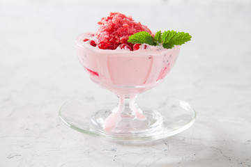 ice cream with raspberry in an ice-cream bowl, selective focus