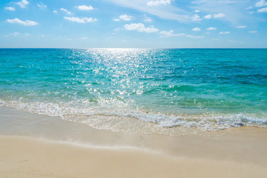 White clouds with blue sky  over calm sea beach in tropical Mald