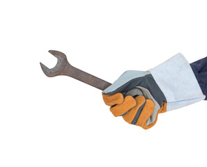 Hand in glove holding spanner on white