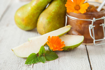 jam from a pear in a jar on a table, selective focus