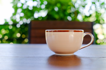 cup of coffee on wood table