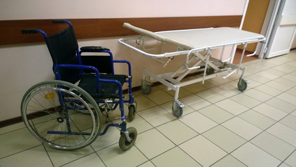 Wheelchair and medical bed in an old medical facility