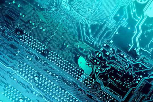 printed circuit board, toned into blue colors. diagonal composition.