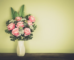 Artificial roses in the vase.