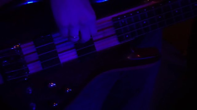 Fragment e-guitar and hand closeup