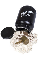 Opened black whey protein jar with protein powder near. Scoop in the powder. Whey protein vanilla and chocolate colors for fitness and bodybuilding gaining muscle.. Isolated on white background.