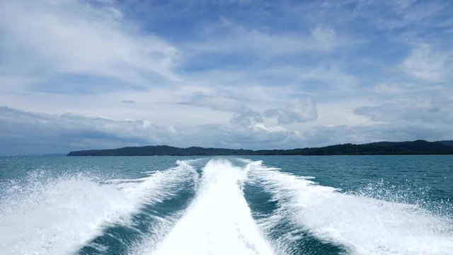 Fast sailing with speed boat ride on the sea on a sunny day
