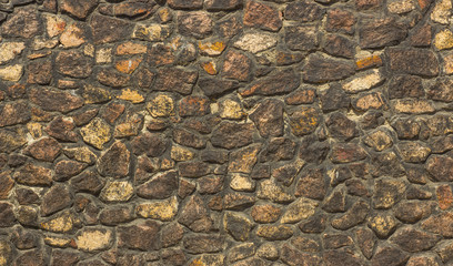 wall of gold and black shale, colorful wild natural stone. very beautiful