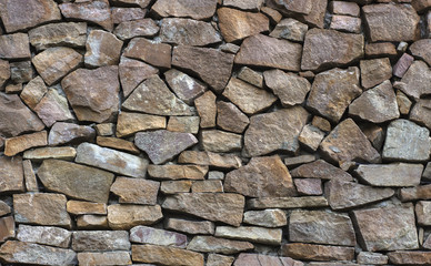 orange wall of a wild stone close-up