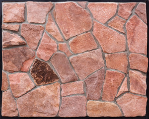 orange wall of a wild stone close-up