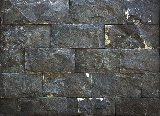 wall of colored rough stone, dolomite and carbonate