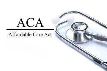 Page with ACA (Affordable Care Act) on the table with stethoscop