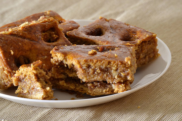 Turkish baklava with walnuts on a white plate