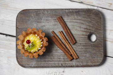 Homemade desserts with fruits for the new year. Desserts for the holidays. Side and top view. On a wooden background