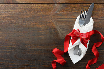 Cutlery on a wooden background.
